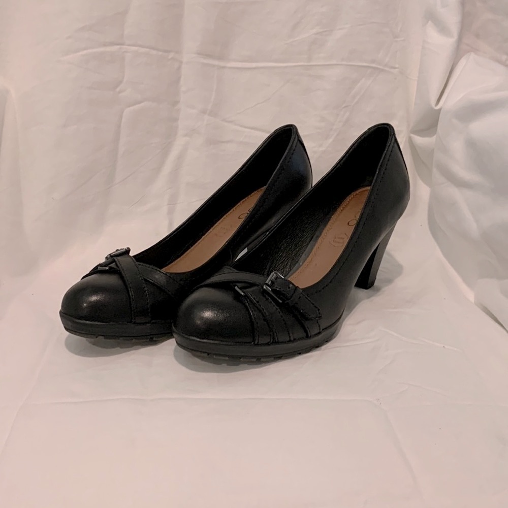 NWOT Aldo black leather pumps with stacked heels and toe buckles.
